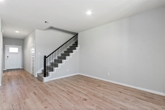 7434 Rivercane Shore Ln, Richmond, TX 77407 - foyer with stairway, light wood-type flooring, baseboards, and recessed lighting