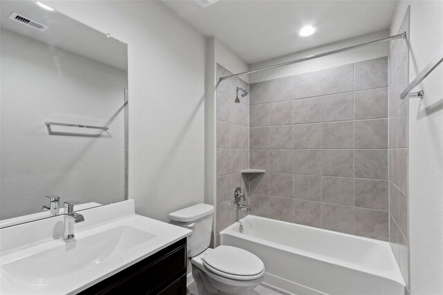 7434 Rivercane Shore Ln, Richmond, TX 77407 - bathroom with toilet, vanity, bathing tub / shower combination, and recessed lighting