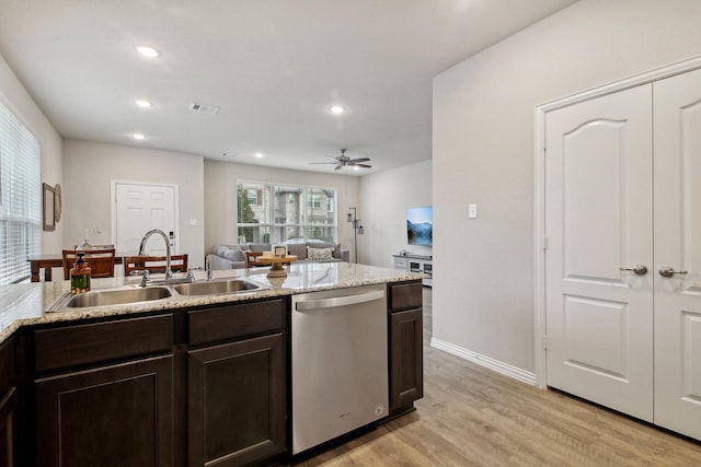 15863 Sundew Prairie Dr, Humble, TX 77346 - kitchen with dishwasher, a sink, dark brown cabinetry, light wood finished floors, and recessed lighting