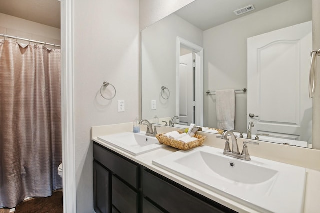 15863 Sundew Prairie Dr, Humble, TX 77346 - bathroom with toilet, double vanity, and curtained shower