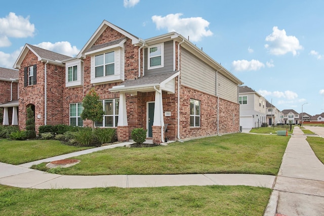 15863 Sundew Prairie Dr, Humble, TX 77346 - view of front facade with a front yard, brick siding, a residential view, and an attached garage