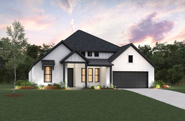 17016 Sweet Iris Ct, Conroe, TX 77302 - modern inspired farmhouse with driveway, brick siding, a standing seam roof, a yard, and metal roof