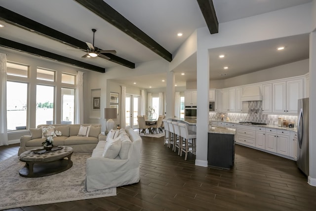 17016 Sweet Iris Ct, Conroe, TX 77302 - living room with beam ceiling, a ceiling fan, healthy amount of natural light, dark wood-type flooring, and recessed lighting