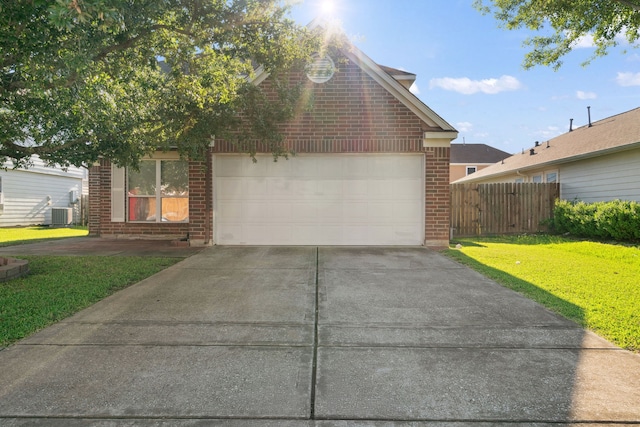 8006 Saffron Ln, Baytown, TX 77521 - view of front of property with brick siding, a garage, driveway, and cooling unit