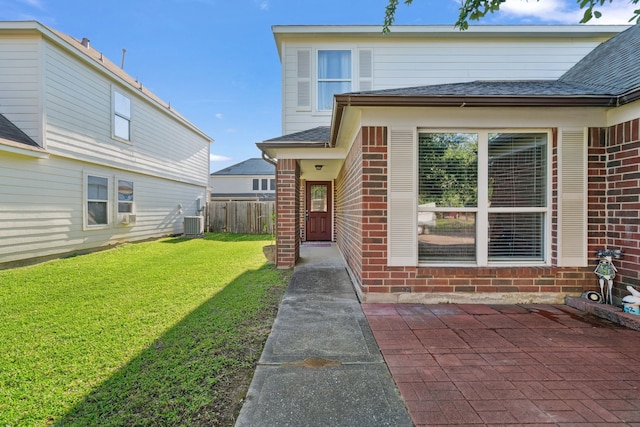 8006 Saffron Ln, Baytown, TX 77521 - view of front of property with brick siding, roof with shingles, central AC, and a patio