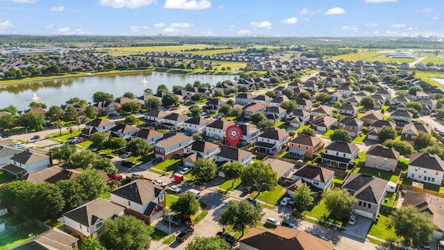 8006 Saffron Ln, Baytown, TX 77521 - aerial perspective of suburban area featuring a large body of water