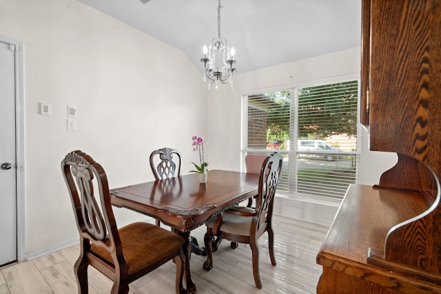 8006 Saffron Ln, Baytown, TX 77521 - dining space with a chandelier, light wood-type flooring, vaulted ceiling, and baseboards