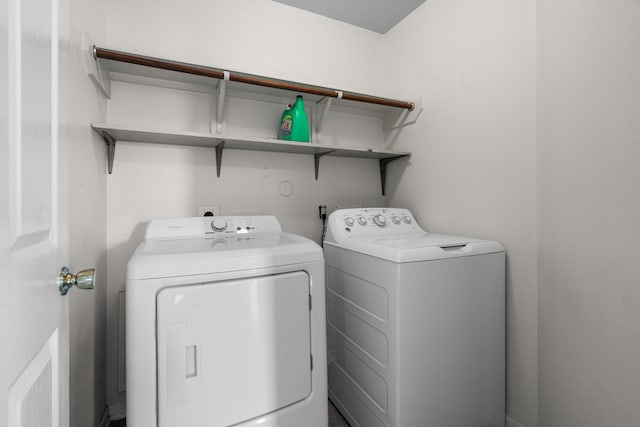 8006 Saffron Ln, Baytown, TX 77521 - laundry area with washing machine and dryer
