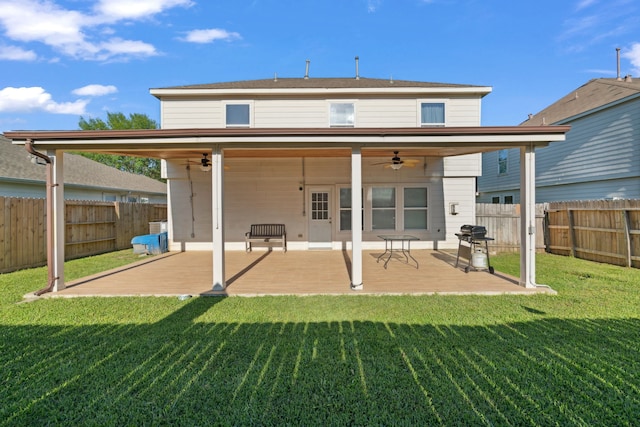 8006 Saffron Ln, Baytown, TX 77521 - back of property with a ceiling fan and a patio area