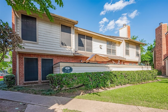 2211 S Kirkwood Rd Unit 19, Houston, TX 77077 - view of front of property featuring brick siding and a chimney