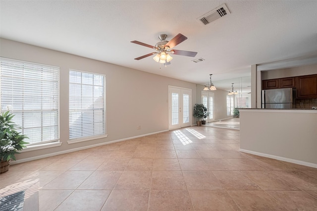 2211 S Kirkwood Rd Unit 19, Houston, TX 77077 - unfurnished living room with a ceiling fan, light tile patterned flooring, baseboards, a chandelier, and french doors