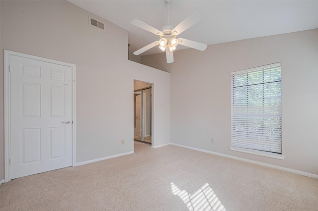 2211 S Kirkwood Rd Unit 19, Houston, TX 77077 - unfurnished bedroom with light colored carpet, baseboards, high vaulted ceiling, and a ceiling fan