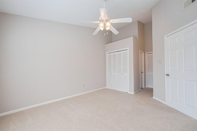 2211 S Kirkwood Rd Unit 19, Houston, TX 77077 - unfurnished bedroom featuring light colored carpet, baseboards, and ceiling fan