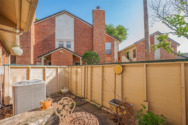 2211 S Kirkwood Rd Unit 19, Houston, TX 77077 - fenced backyard featuring central AC unit