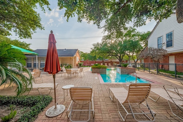 2211 S Kirkwood Rd Unit 19, Houston, TX 77077 - community pool featuring a patio area and fence