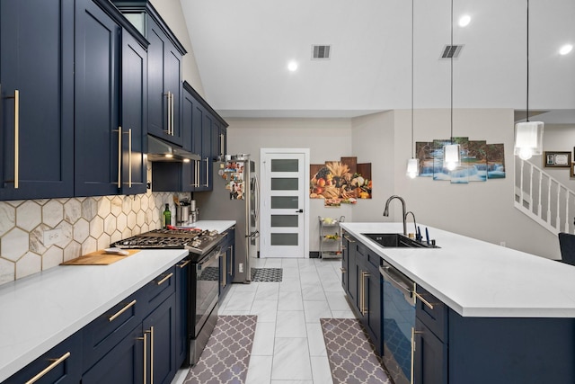 16709 W Rayburn Dr, Conroe, TX 77302 - kitchen with stainless steel appliances, under cabinet range hood, a sink, light countertops, and backsplash