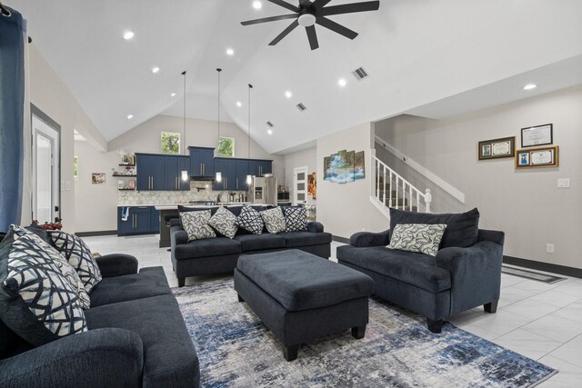 16709 W Rayburn Dr, Conroe, TX 77302 - living area featuring high vaulted ceiling, a ceiling fan, baseboards, light tile patterned floors, and stairs