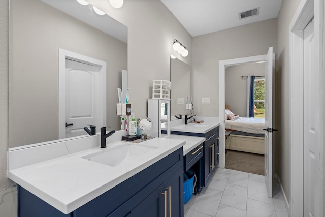 16709 W Rayburn Dr, Conroe, TX 77302 - bathroom featuring marble finish flooring, vanity, and ensuite bathroom