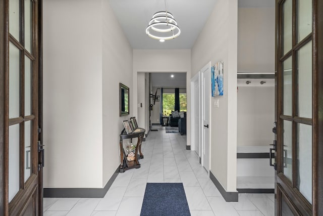 16709 W Rayburn Dr, Conroe, TX 77302 - entrance foyer featuring baseboards and a chandelier