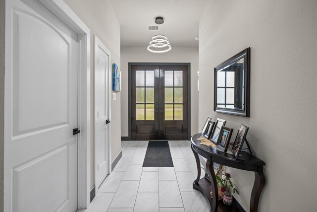 16709 W Rayburn Dr, Conroe, TX 77302 - doorway featuring french doors and light tile patterned flooring