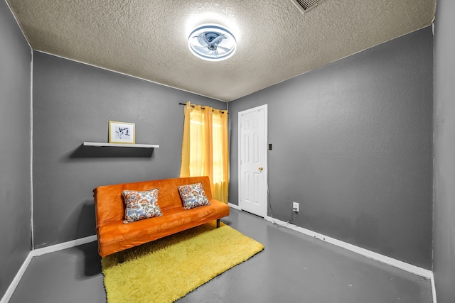 15153 Grassington Dr, Channelview, TX 77530 - sitting room with finished concrete floors and a textured ceiling