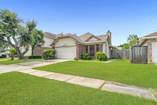 15153 Grassington Dr, Channelview, TX 77530 - view of front of house featuring a garage, driveway, and brick siding