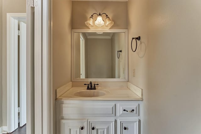 bathroom with vanity and crown molding