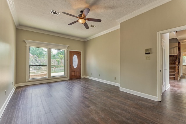 foyer featuring ceiling fan, dark wood-style floors, a textured ceiling, baseboards, and ornamental molding