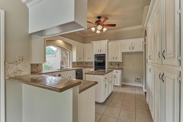 kitchen with a sink, ceiling fan, a peninsula, decorative backsplash, and light tile patterned flooring