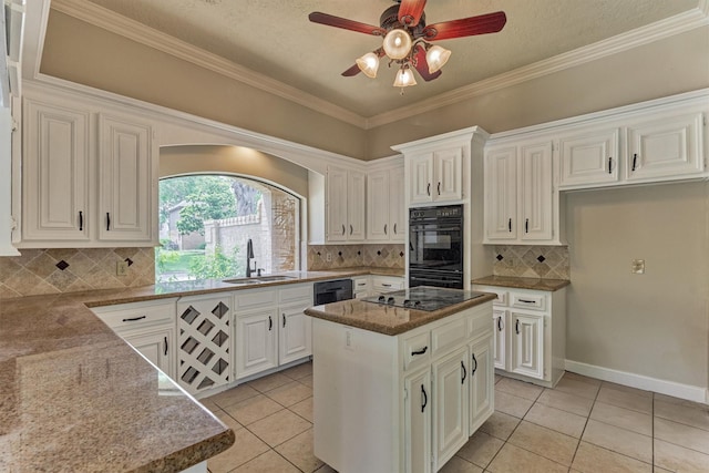 kitchen with a sink, black appliances, light tile patterned floors, a ceiling fan, and ornamental molding