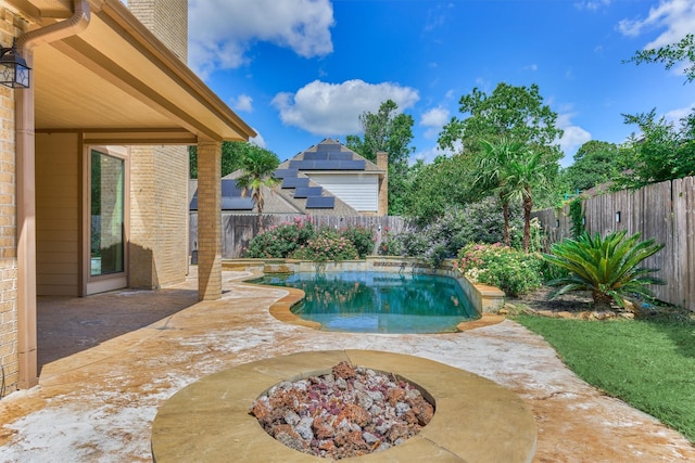 view of pool with a fenced backyard and a patio