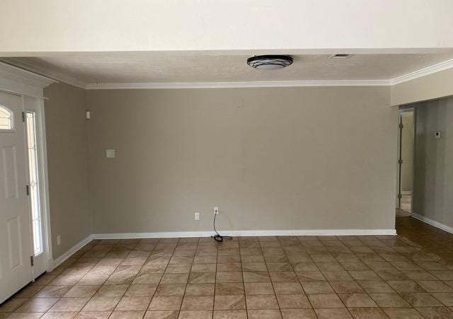 404 Friery St, Dayton, TX 77535 - spare room with crown molding and baseboards