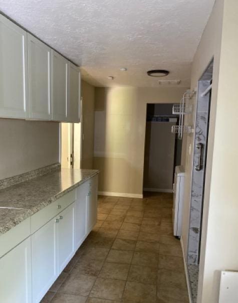 404 Friery St, Dayton, TX 77535 - hallway with a textured ceiling