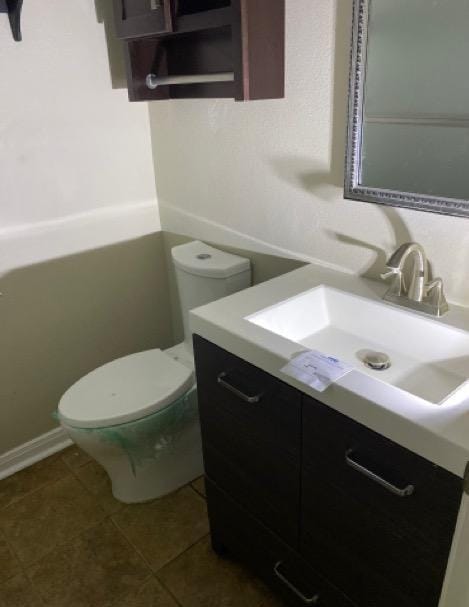 404 Friery St, Dayton, TX 77535 - bathroom featuring toilet, vanity, and tile patterned flooring