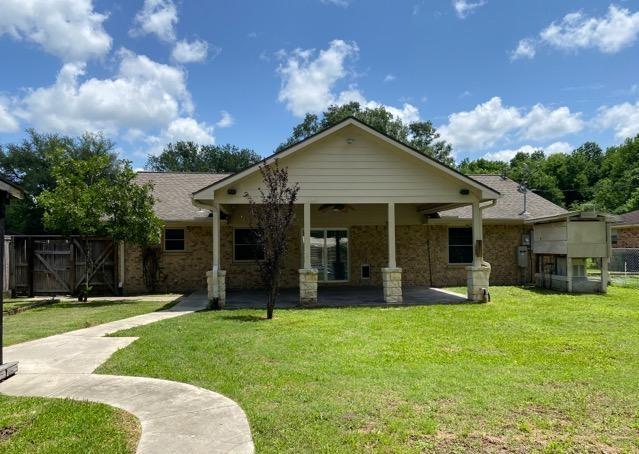 404 Friery St, Dayton, TX 77535 - back of house featuring a patio and a ceiling fan