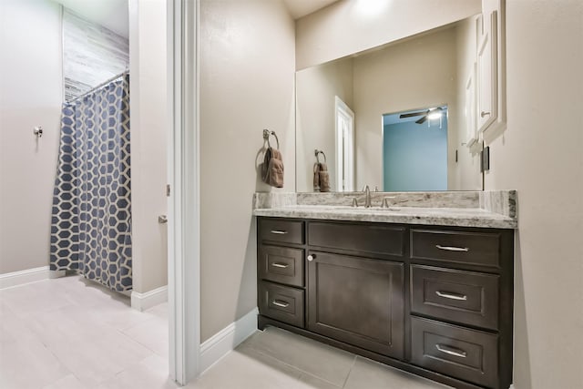 bathroom featuring tile patterned floors, vanity, a ceiling fan, and a shower with curtain