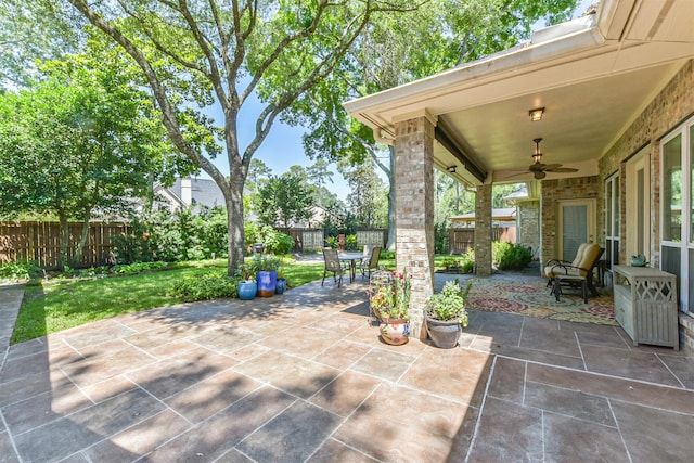 view of patio / terrace with a ceiling fan and outdoor dining area