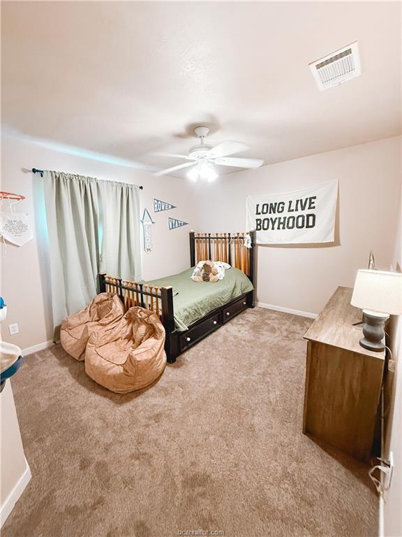 52 Fairway Dr, Normangee, TX 77871 - carpeted bedroom featuring a ceiling fan and baseboards