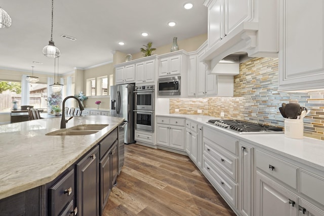 146 Painted Trillium Dr, Conroe, TX 77304 - kitchen featuring a sink, white cabinets, stainless steel appliances, plenty of natural light, and recessed lighting