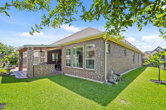 146 Painted Trillium Dr, Conroe, TX 77304 - back of house with a ceiling fan, a patio, and brick siding