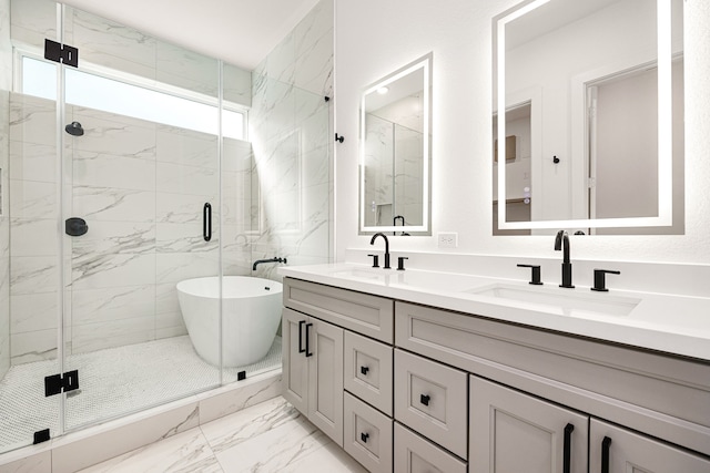 747 Dumble St, Houston, TX 77023 - bathroom with marble look tile flooring, a stall shower, double vanity, and a freestanding bath