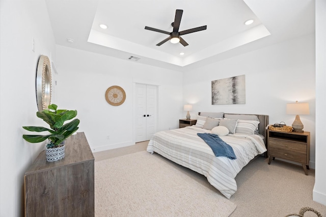 5814 Highland Sky Ln, Houston, TX 77091 - bedroom with light colored carpet, recessed lighting, a tray ceiling, and ceiling fan
