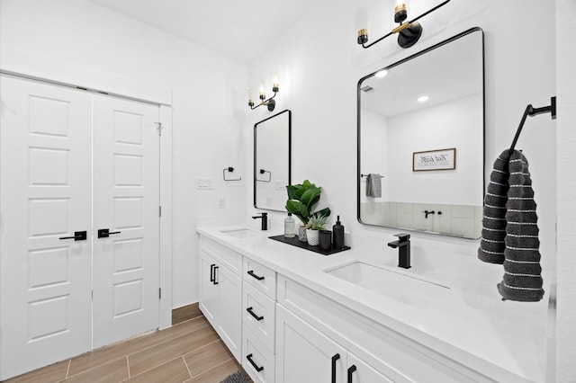 5814 Highland Sky Ln, Houston, TX 77091 - full bathroom featuring double vanity and wood finished floors