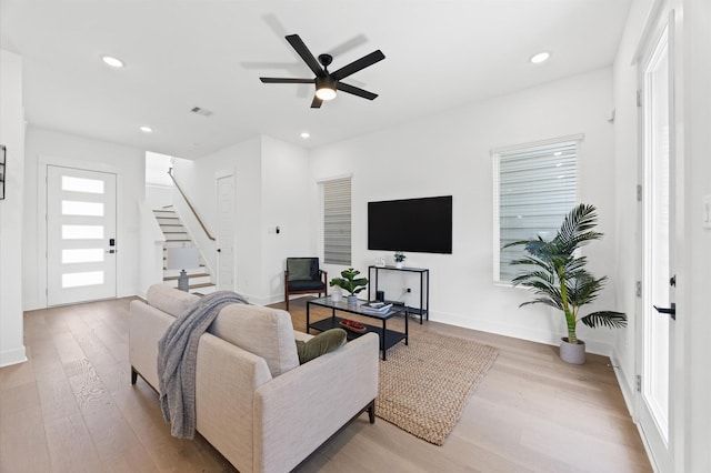 5814 Highland Sky Ln, Houston, TX 77091 - living area featuring wood finished floors, stairway, recessed lighting, and ceiling fan