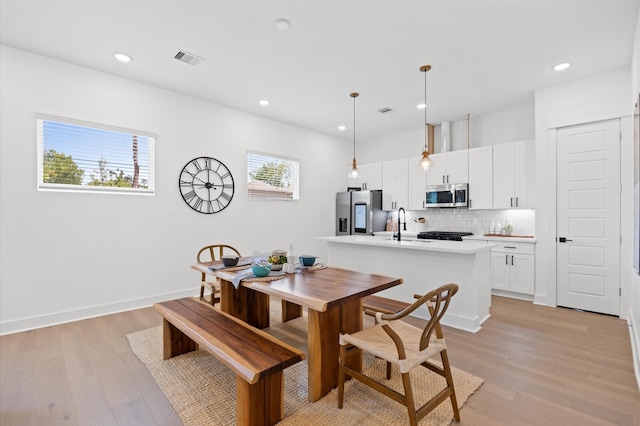 5814 Highland Sky Ln, Houston, TX 77091 - dining room featuring light wood-type flooring and recessed lighting