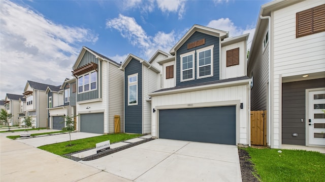 5814 Highland Sky Ln, Houston, TX 77091 - view of property featuring a garage, driveway, a residential view, and board and batten siding