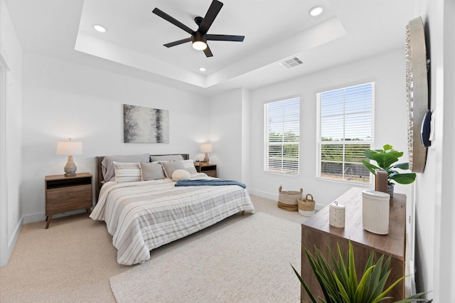 5814 Highland Sky Ln, Houston, TX 77091 - bedroom with recessed lighting, a tray ceiling, light carpet, and a ceiling fan