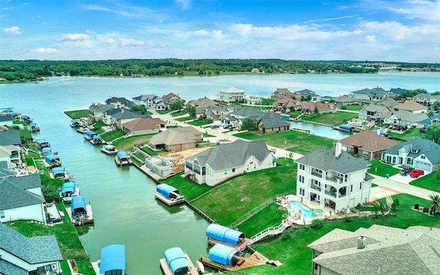 12590 St Ann Ct, Willis, TX 77318 - aerial perspective of suburban area featuring a large body of water
