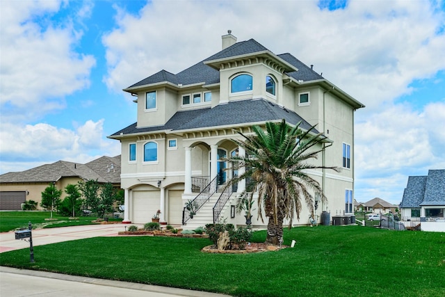 12590 St Ann Ct, Willis, TX 77318 - view of front of property featuring an attached garage, concrete driveway, stucco siding, a chimney, and stairway