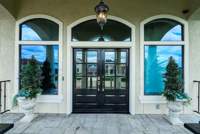 12590 St Ann Ct, Willis, TX 77318 - entrance to property with french doors and stucco siding